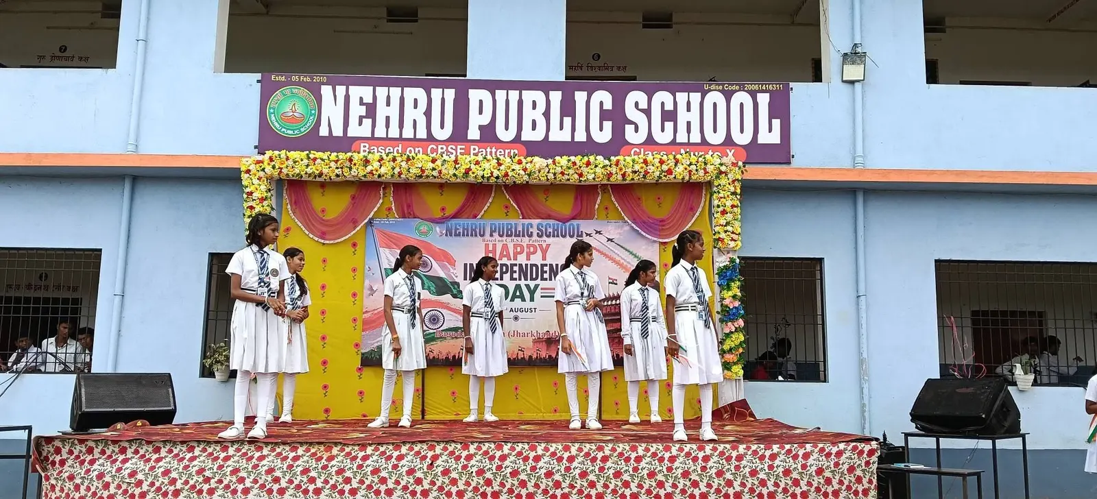 Independence Day stage in front of the school building