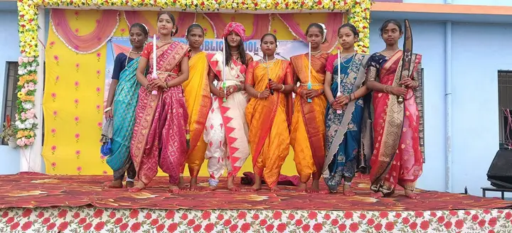 Students in traditional costumes on the Independence Day stage