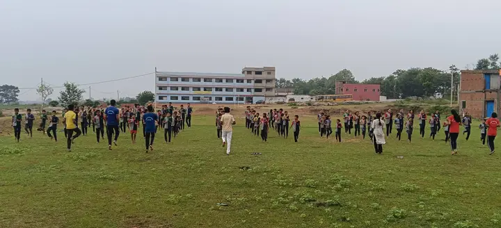 Students warming up for yoga on the school ground